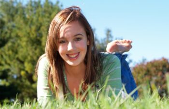 Teenage girl relaxing in the grass